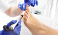 Why is it necessary to perform therapeutic foot care at least once a year?